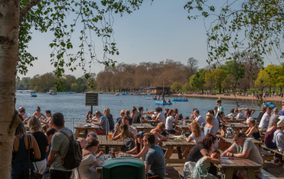 Cafe and benches by lake in Hyde Park